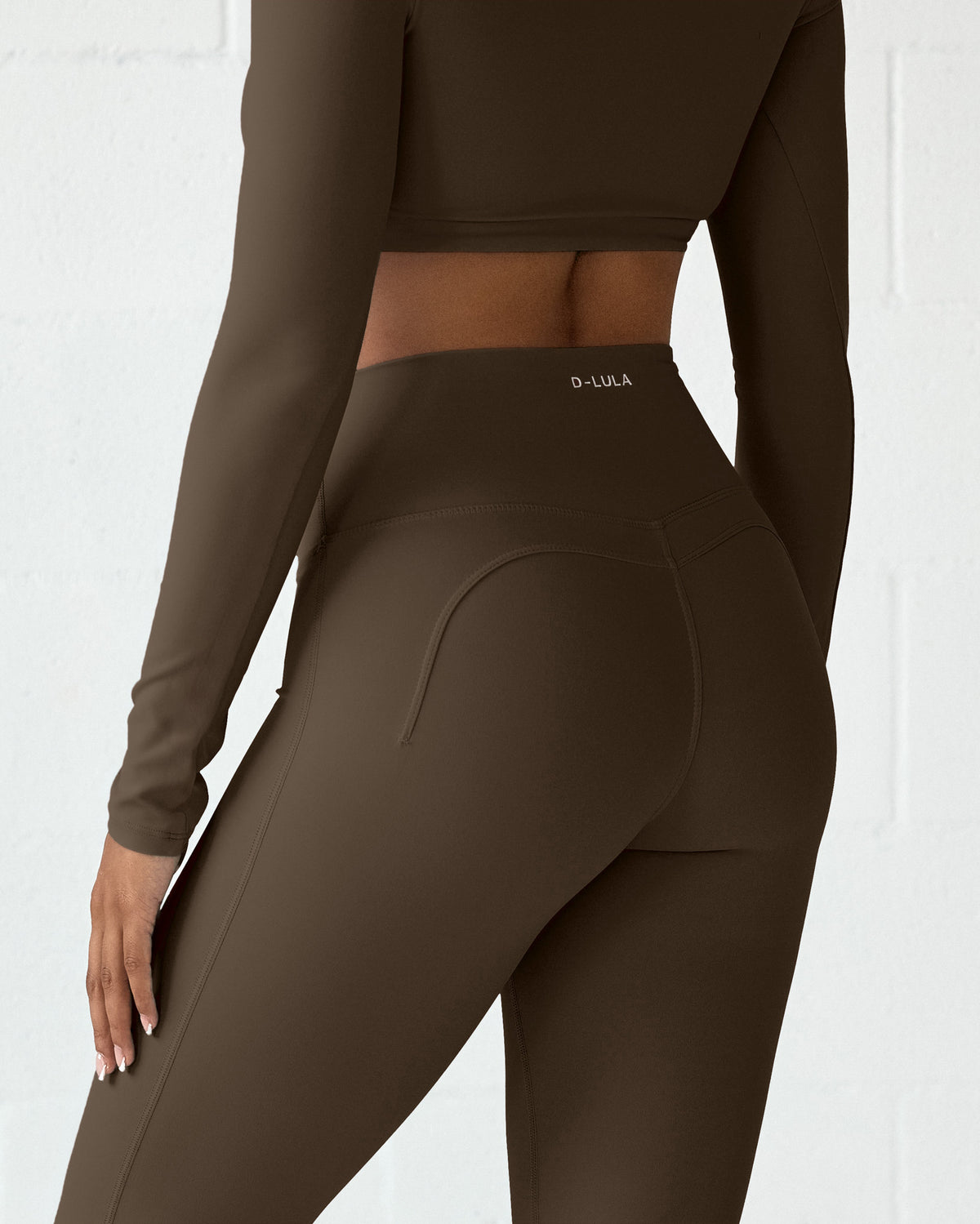 Luxe Motion Flare Leggings in Espresso, back view with D-LULA waistband logo